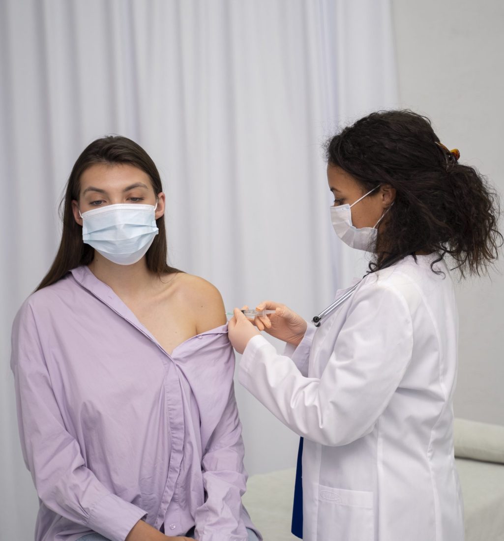 medium-shot-patient-getting-vaccinated-min